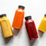 Flat lay of the best drinks for gut health including kombucha, kefir, ginger tea, green tea, and bone broth, promoting daily sips for digestive wellness.