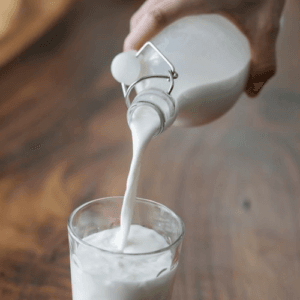 kefir glass pouring white drink