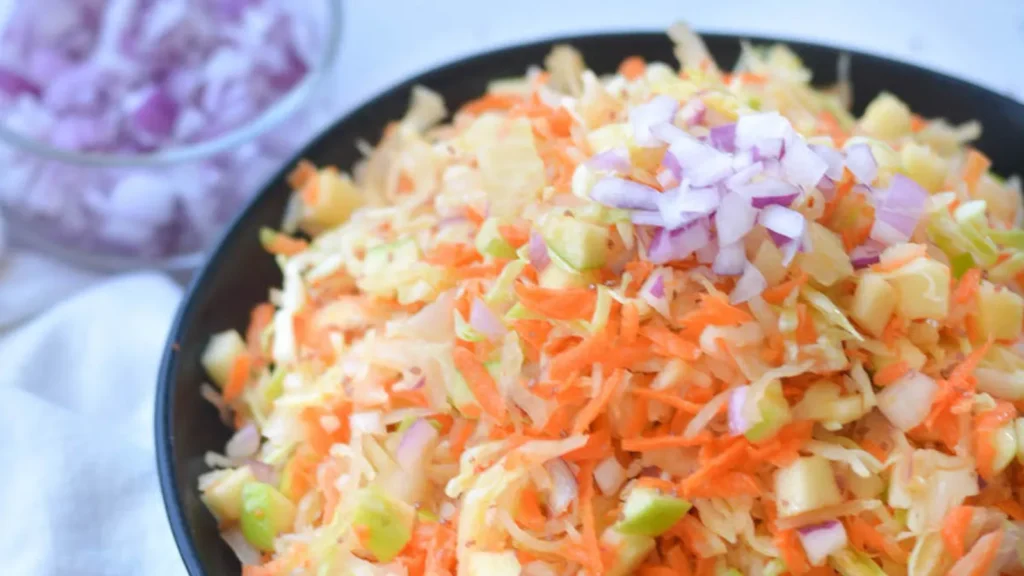 Collage of meals topped with sauerkraut—salad, sandwich, soup—showing easy ways to add sauerkraut benefits for gut health to your daily diet.
