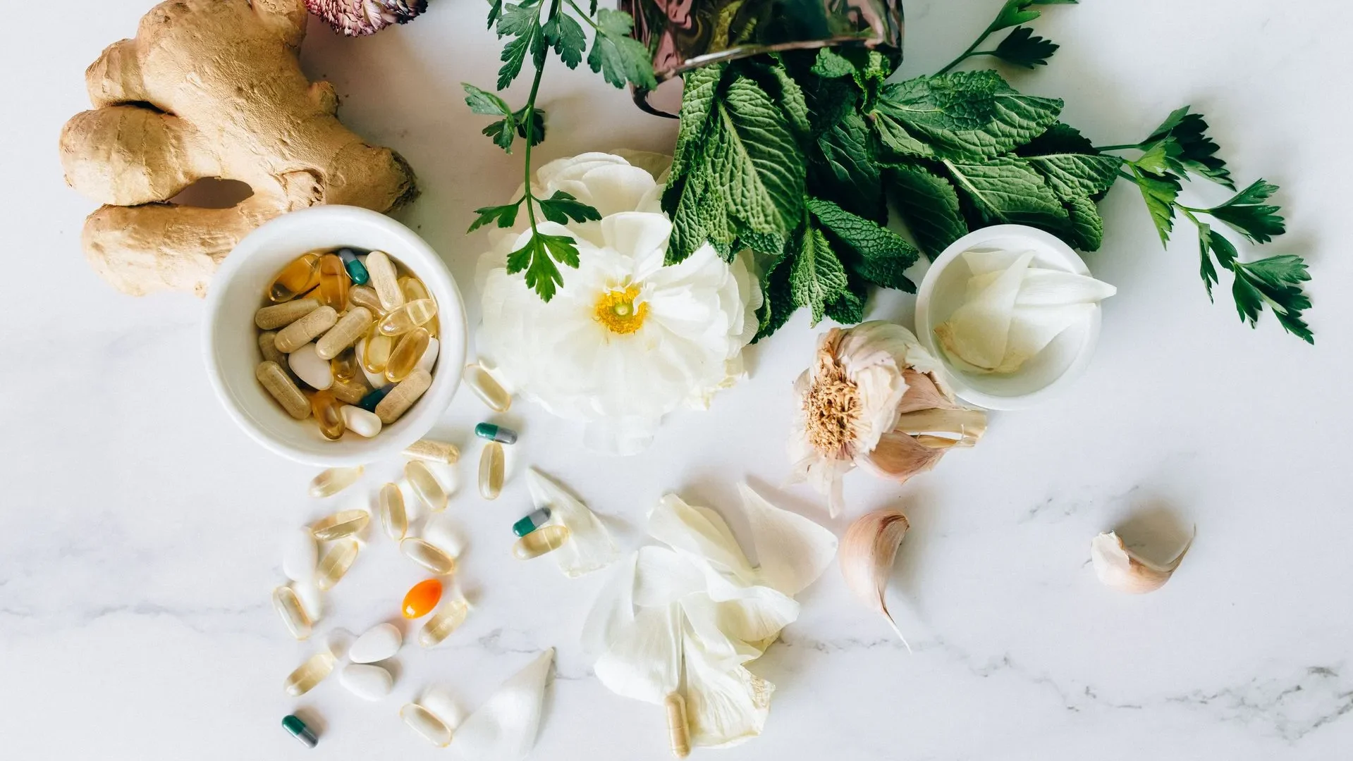 A bowl of yogurt with collagen peptides, kimchi, and chopped vegetables, showing how to integrate peptides for gut health into a wider gut-friendly diet.