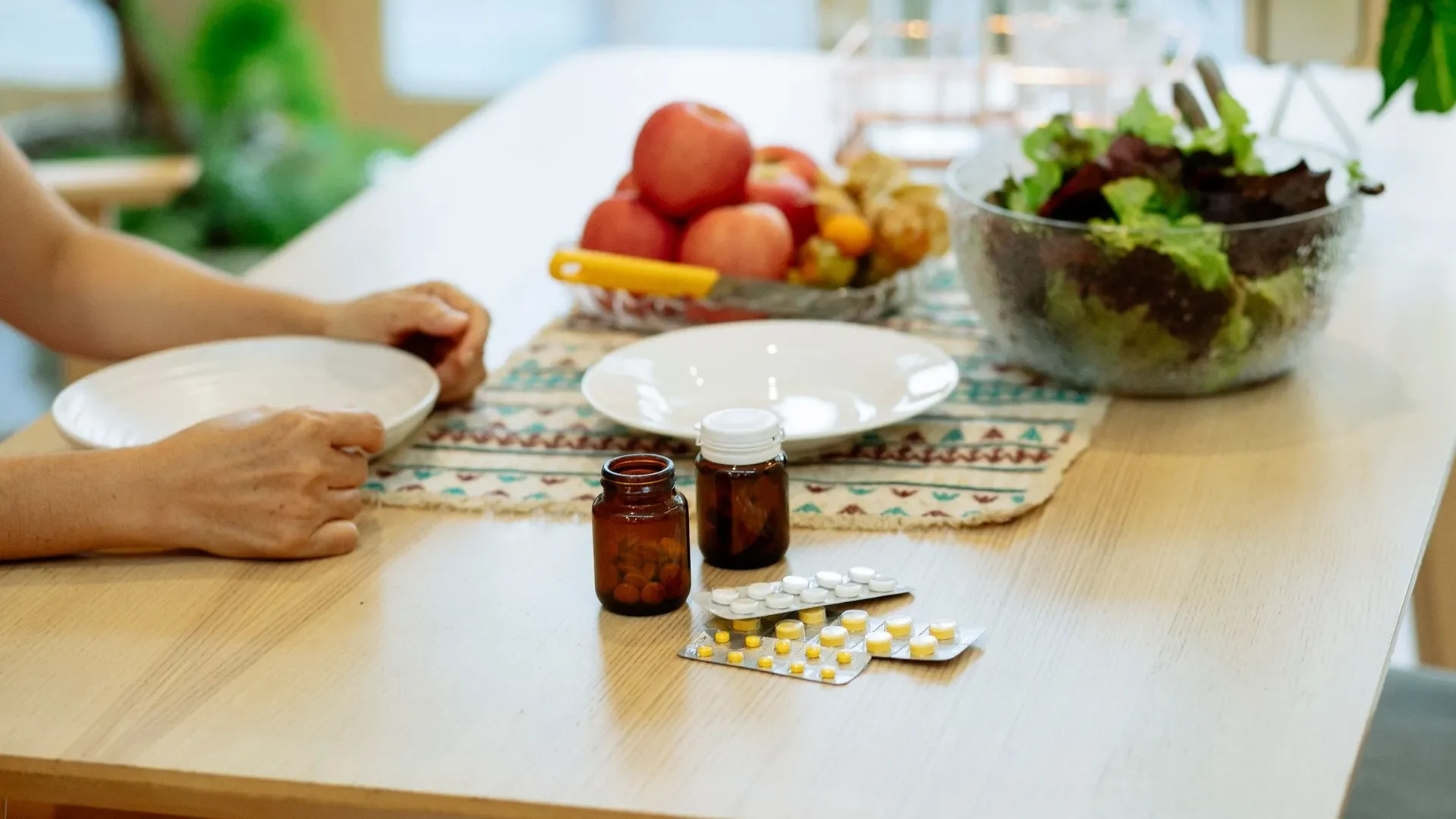 Person smiling and holding a jar of collagen peptides and a bowl of fruit, reflecting the evidence-based conclusion that peptides for gut health can be a valuable tool.