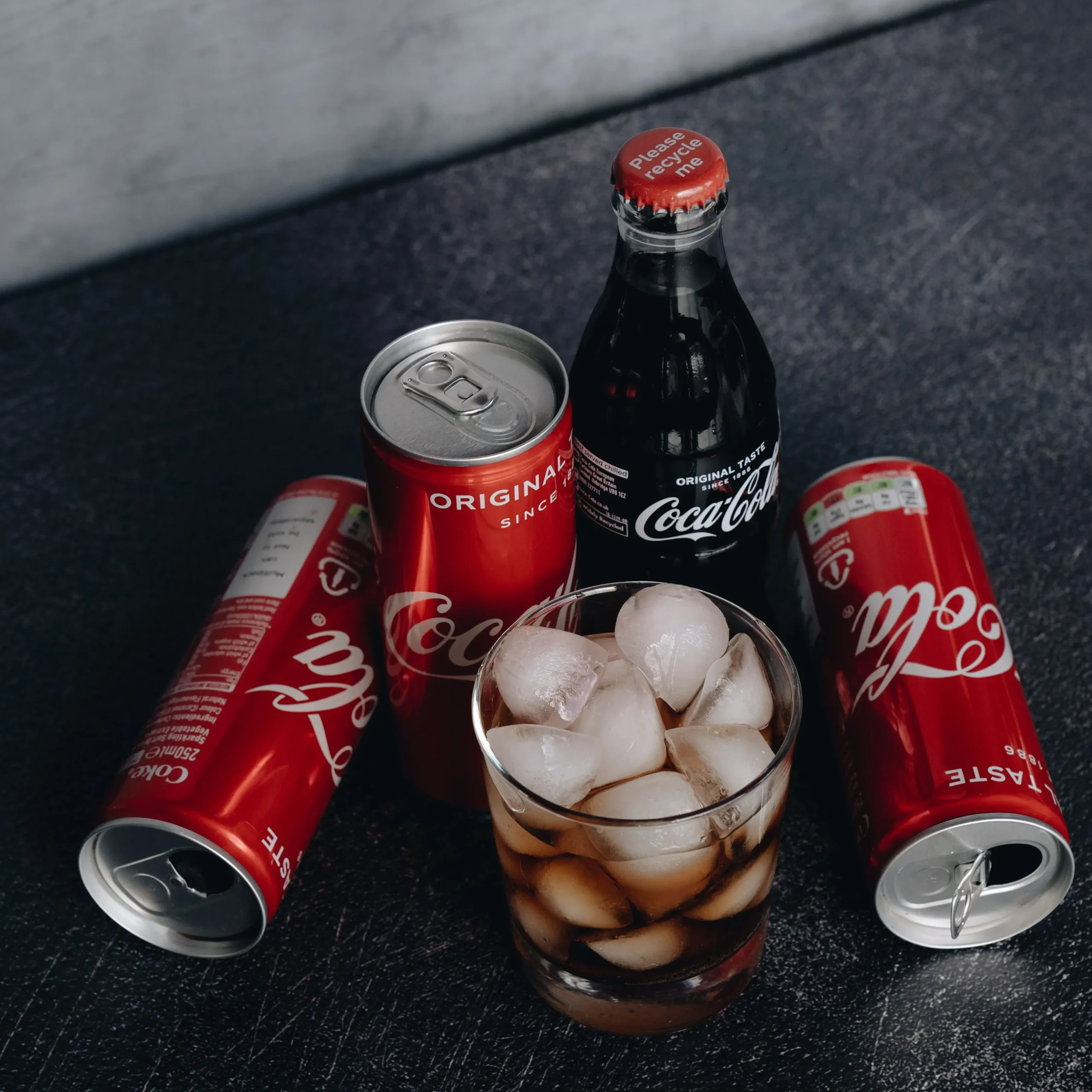 7 worst drinks for gut health - cans of soda and sugary beverages