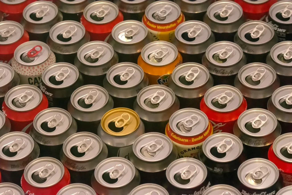 7 worst drinks for gut health - cans of soda and sugary beverages
