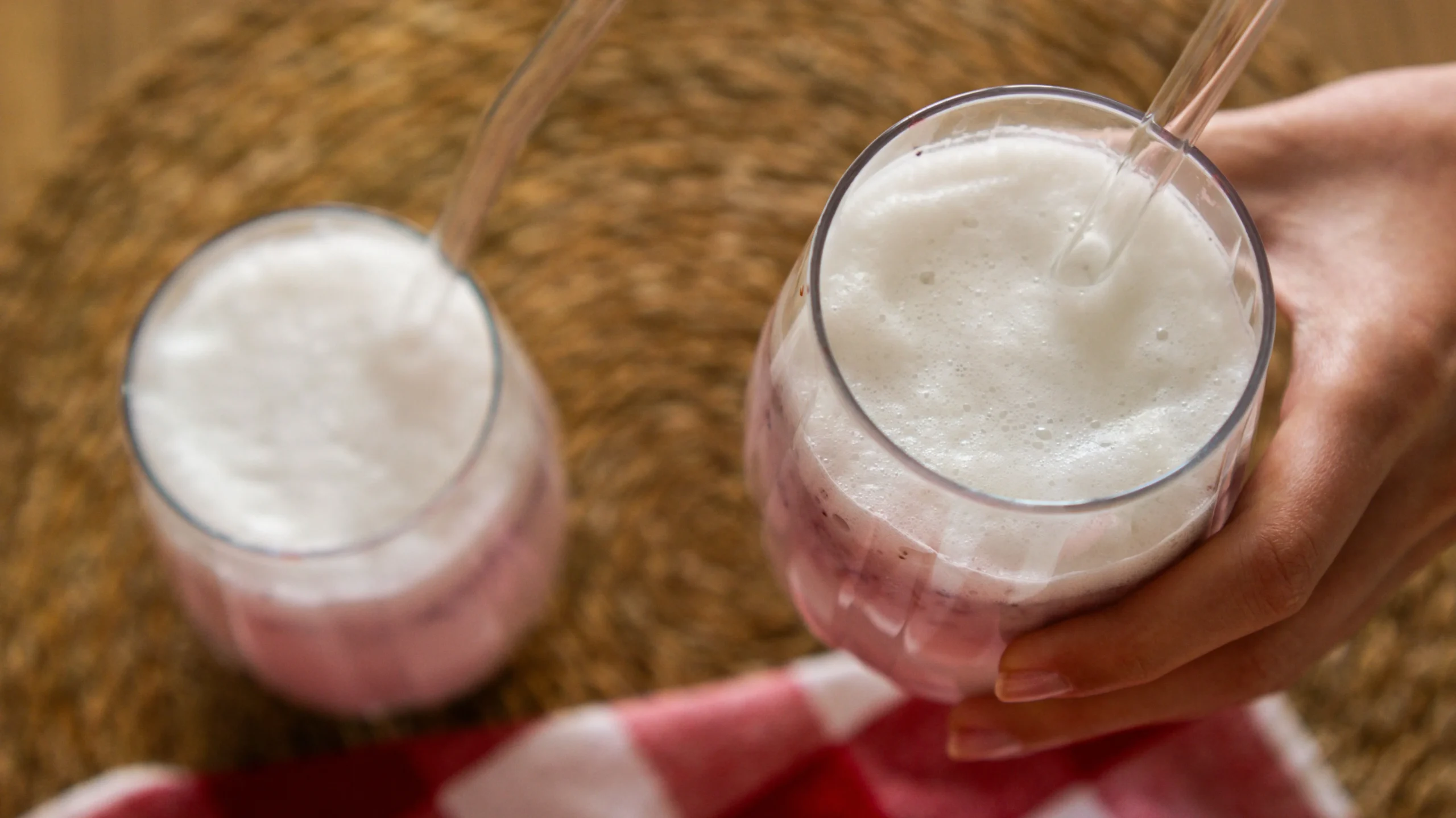 Creamy milk kefir poured into a glass, a top choice among the best probiotic drinks with over 30 bacterial strains.