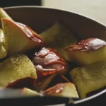 A warm bowl of stewed apples with cinnamon, illustrating the simple, comforting food that supports stewed apples for gut health.