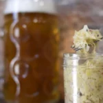 Collage of popular fermented foods—sauerkraut, kimchi, kombucha, kefir, miso, and tempeh—illustrating the simple answer to what is a fermented food with varied examples.