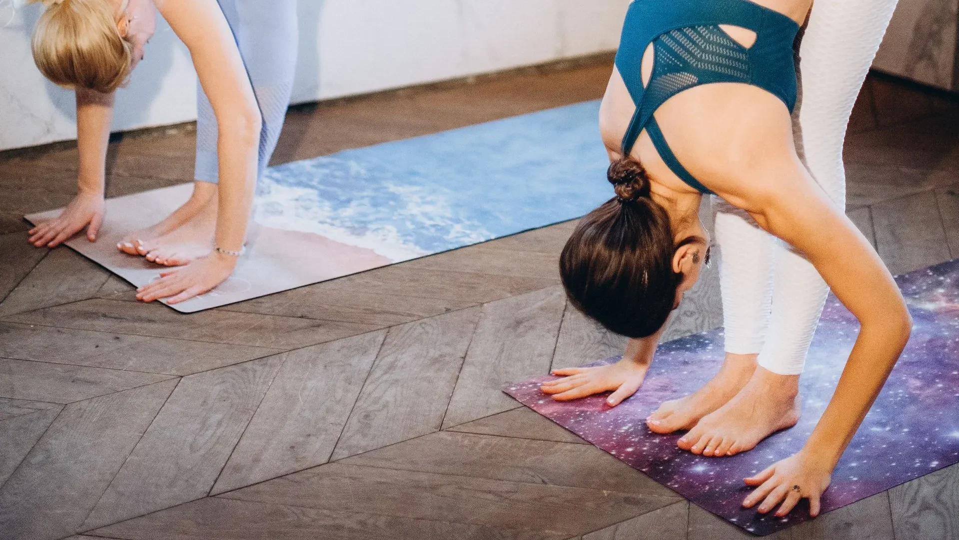 Woman doing a Standing Forward Fold (Uttanasana), a yoga for gut health pose that gently compresses the abdomen to aid digestion and activate rest mode.