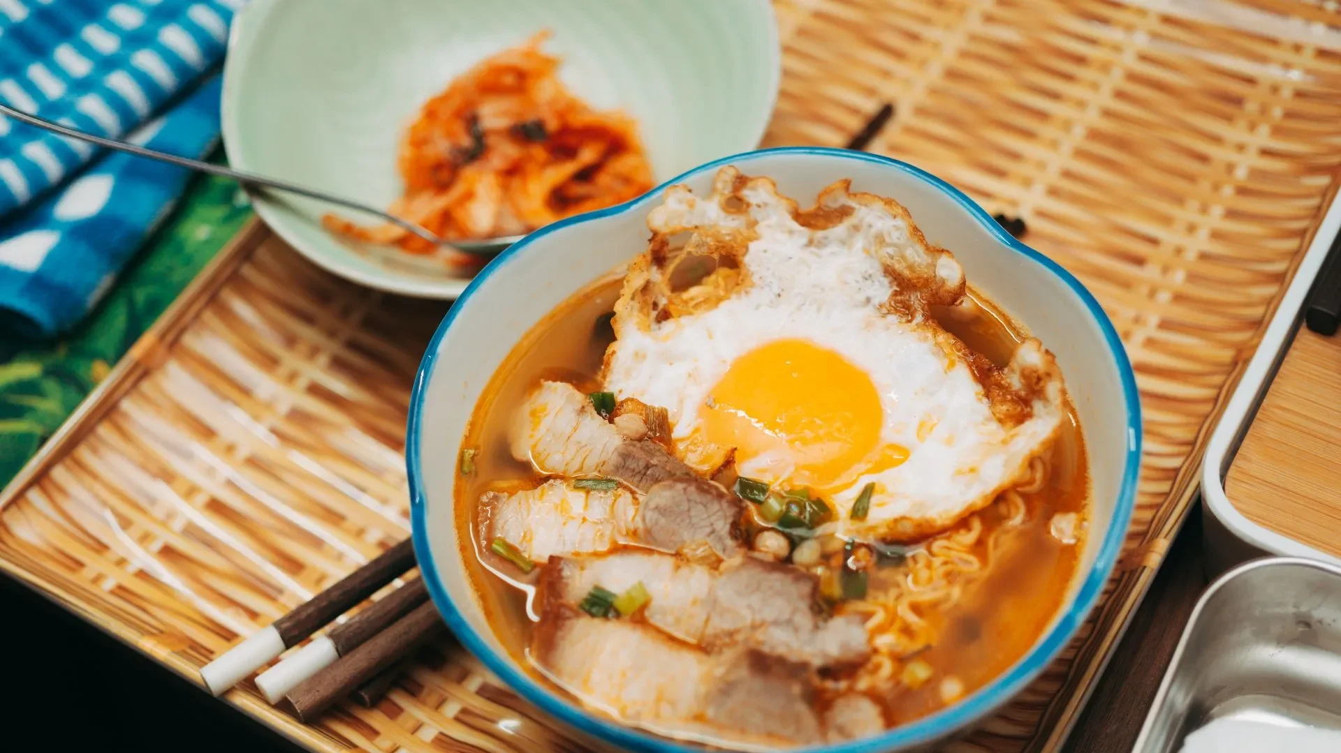 Collage of dishes topped with kimchi—omelet, rice bowl, soup, and tacos—showing simple ways to make daily kimchi benefits for gut health a delicious habit.