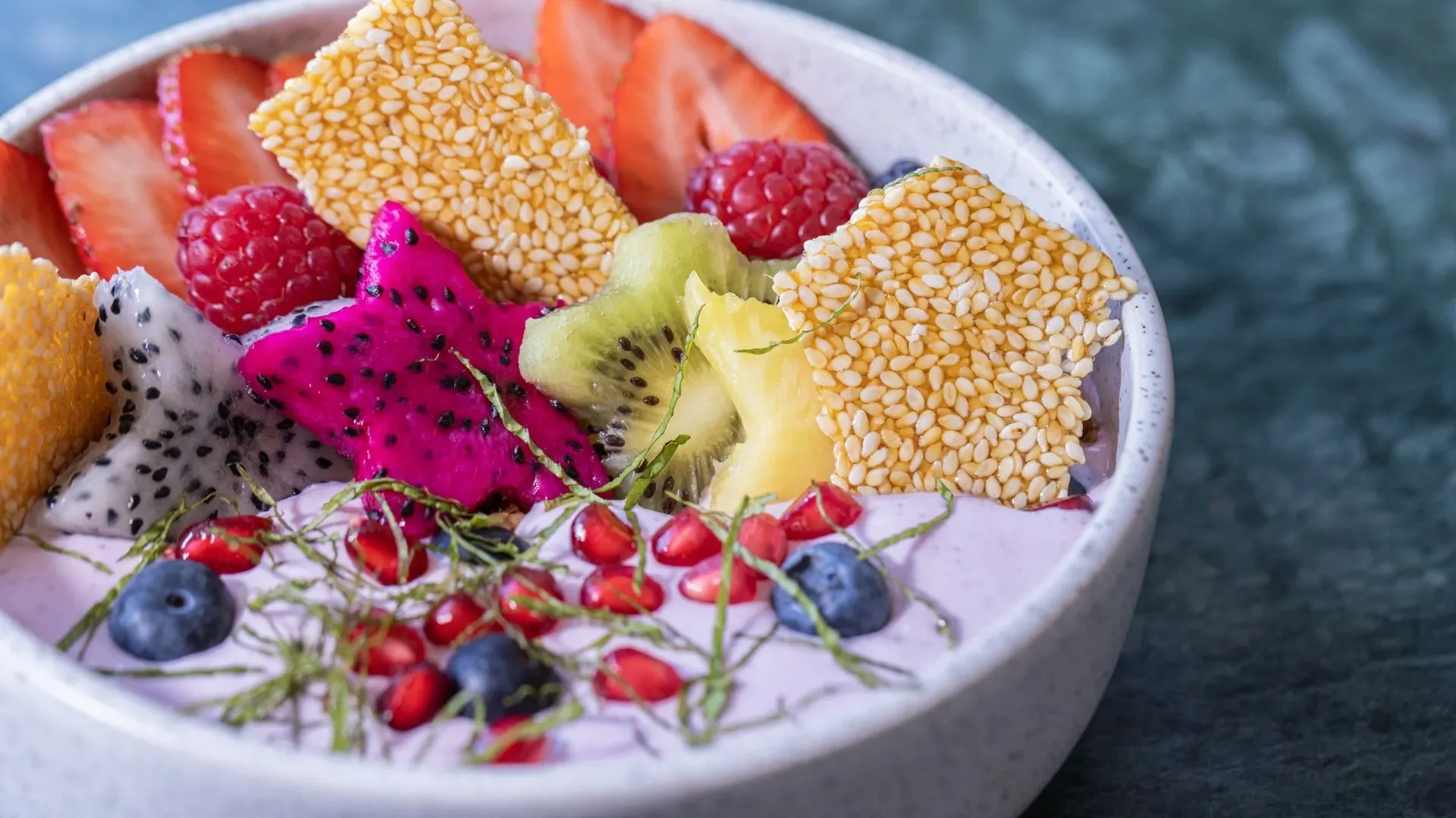 A smoothie, a salad dressing, and a breakfast bowl all made with kefir, showing easy ways to get daily kefir benefits for gut health.